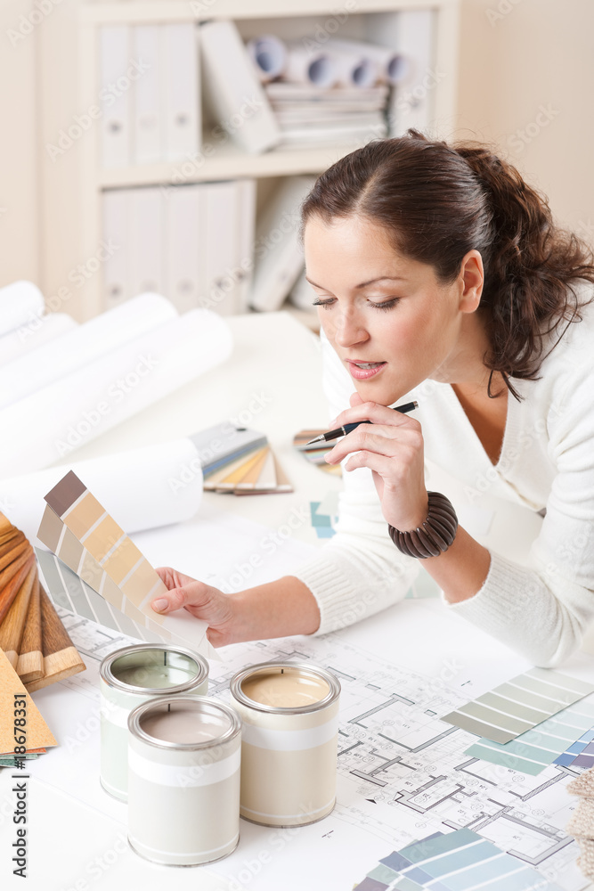 Young female interior designer at office Young female interior designer at office