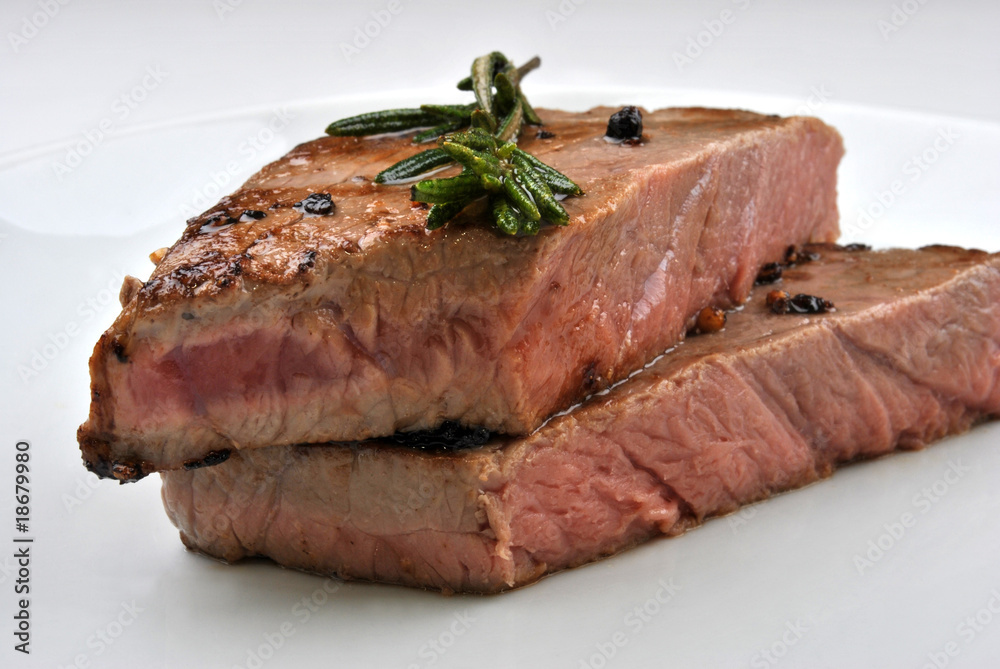 grilled rump steak with organic rosemary on a plate grilled rump steak with organic rosemary on a plate