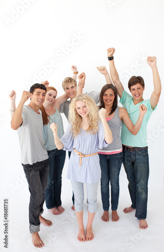 Successful friends standing against white background
