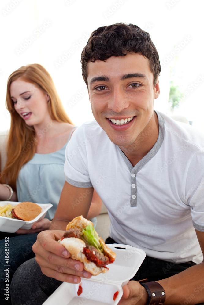 Friends eating burgers and fries Friends eating burgers and fries