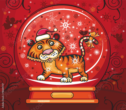 Cute friendly tiger, wearing Santa cap,  Inside of the snow-dome