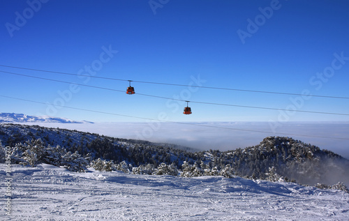 Cable car ski lift over mountain landscape