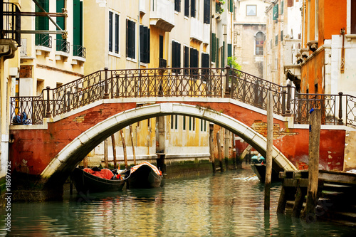 Colorful bridge across canal in Venice, Italy