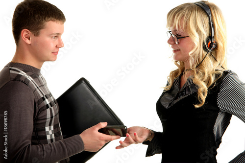 businessman is exchange laptop to the phone with a women