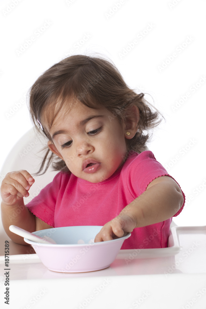 Baby girl is eating by herself Baby girl is eating by herself