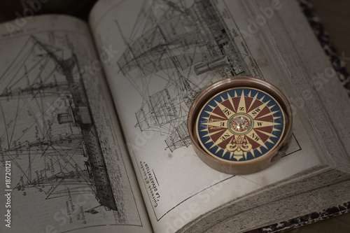 Old book and compass photo