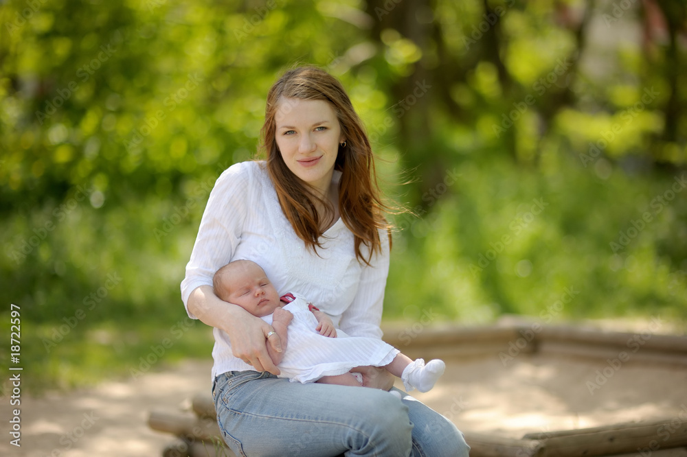 Young mother and her newborn baby Young mother and her newborn baby