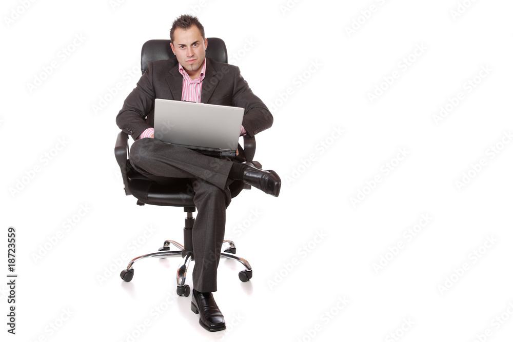 Relaxed young businessman, sitting on a chair. Relaxed young businessman, sitting on a chair.
