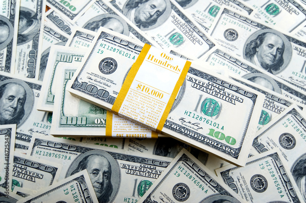 Fototapeta premium Stack of dollars on money background