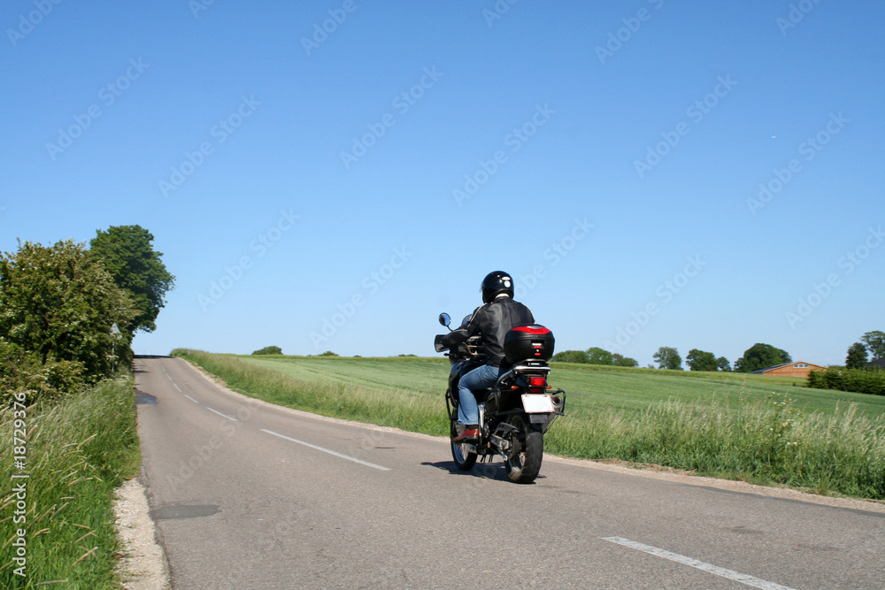 biker driving away