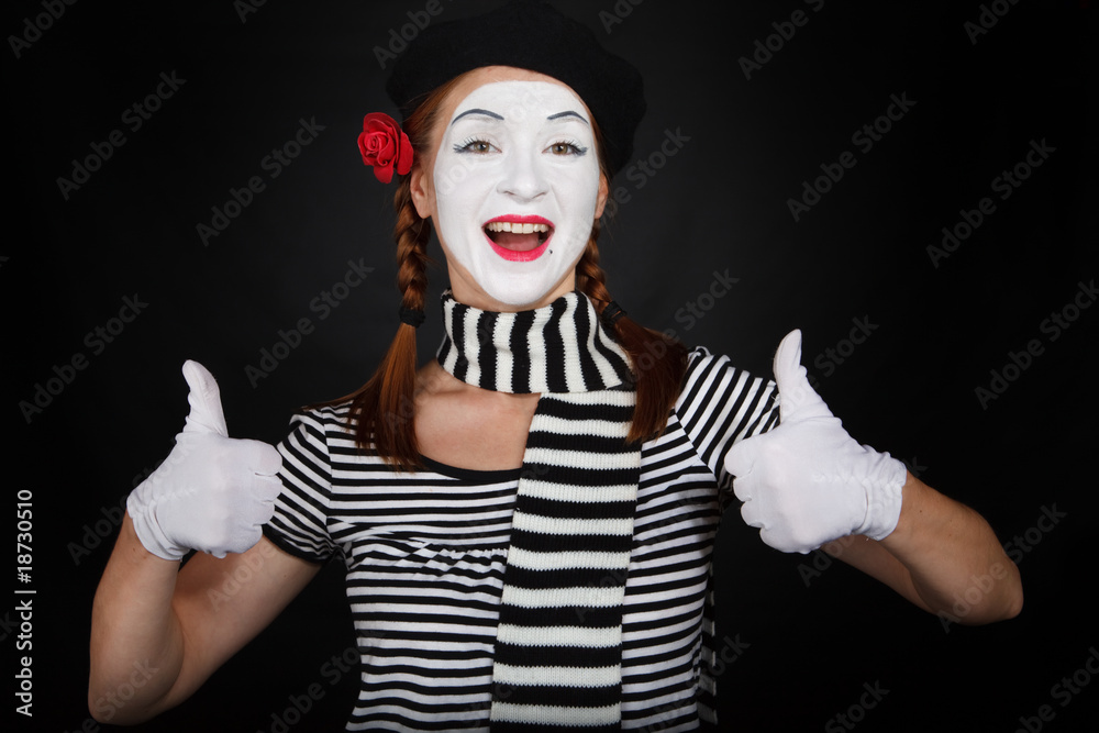 Happy mime comedian showing thumbs up Happy mime comedian showing thumbs up