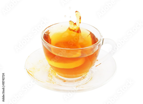 Glass cup of tea with lemon isolated on white