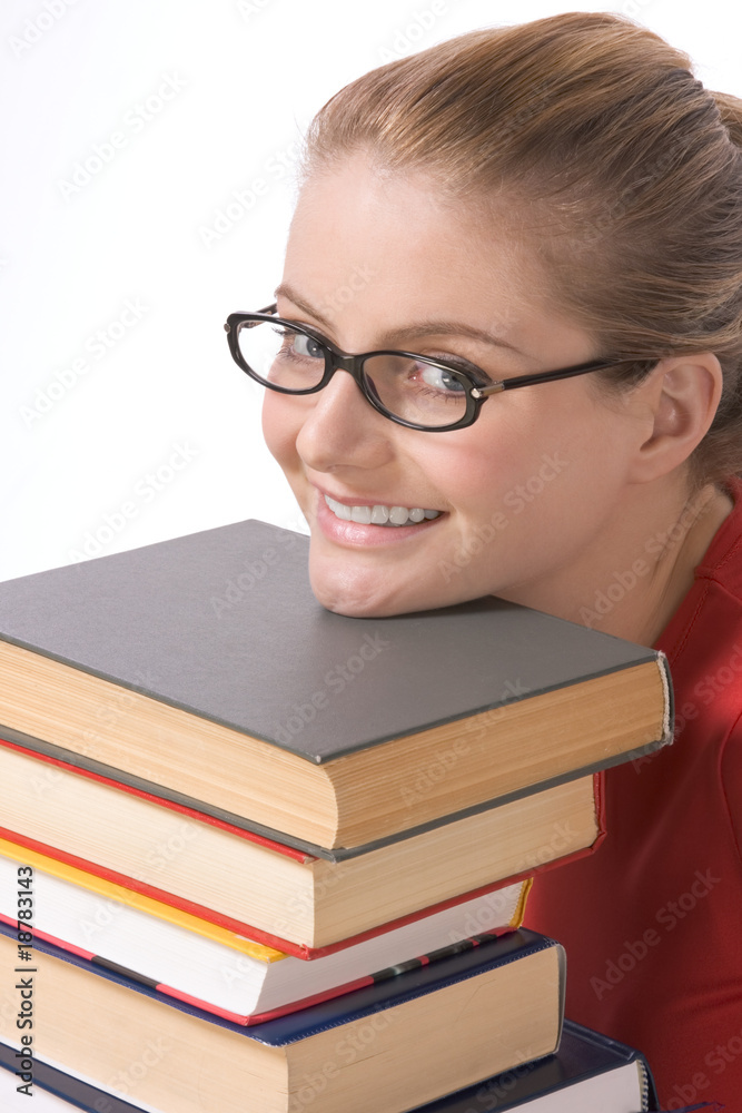 Caucasian student in eye glasses on pile of book Caucasian student in eye glasses on pile of book