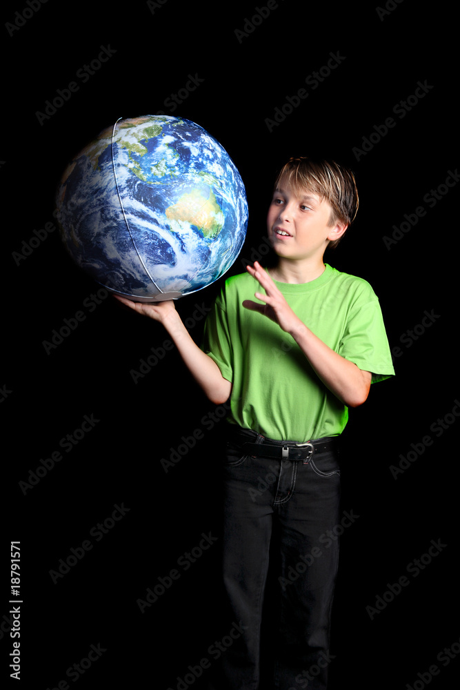 Boy Earth in his hand looks with wonder fascination Boy Earth in his hand looks with wonder fascination