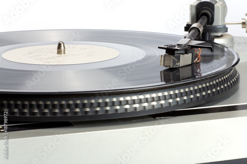 Stylish 20-years old turntable with vinyl record having