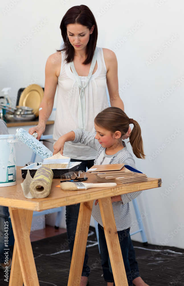 Mother and her daughter preparing paint