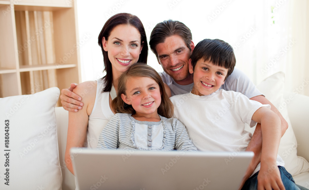 Happy family surfing the internet Happy family surfing the internet