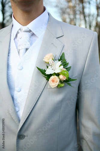 The groom at a wedding ceremony. Boutonniere for jacket