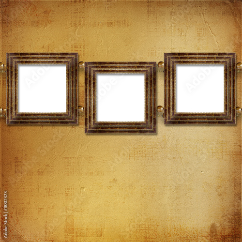 Three gold frames Victorian style on the wall
