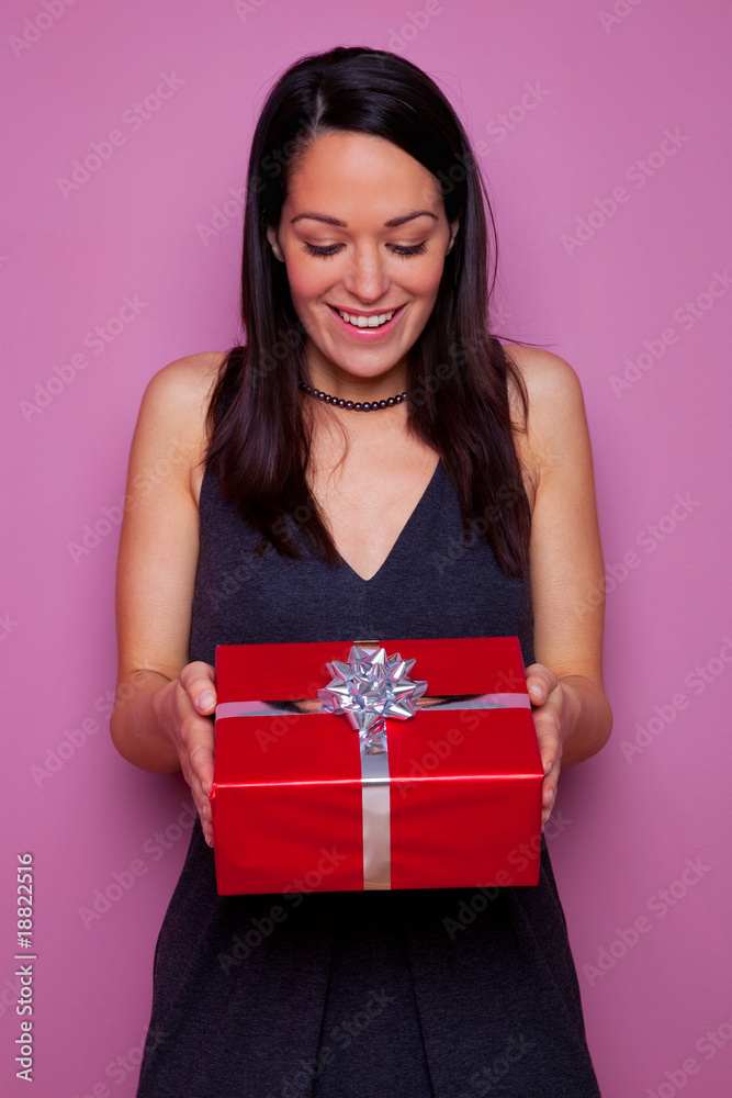 Fototapeta premium Woman happy as she receives a gift