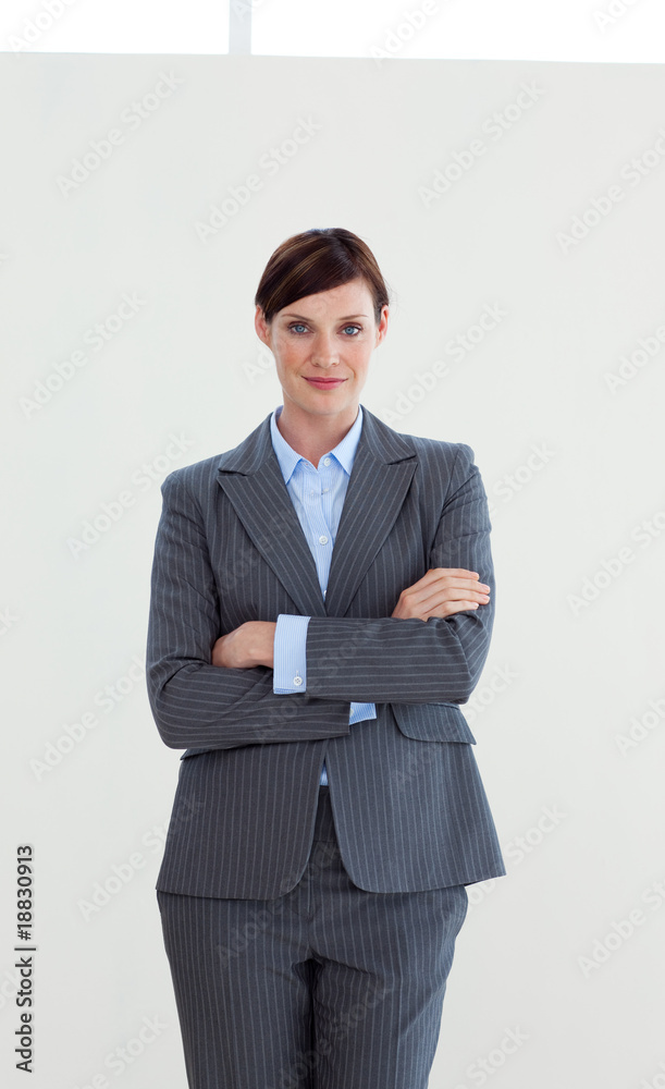 Attractive businesswoman with folded arms Attractive businesswoman with folded arms