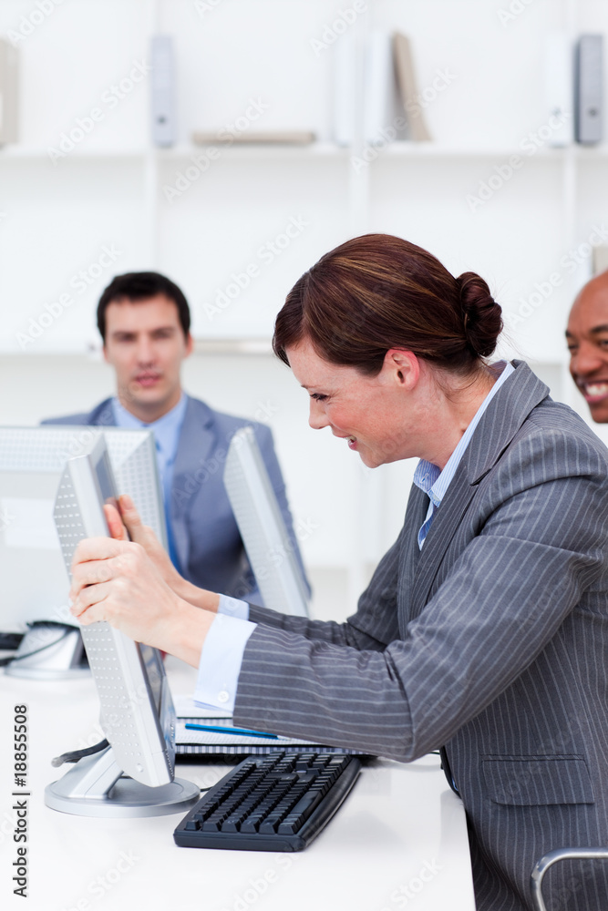 Businesswoman getting frustrated with a computer Businesswoman getting frustrated with a computer