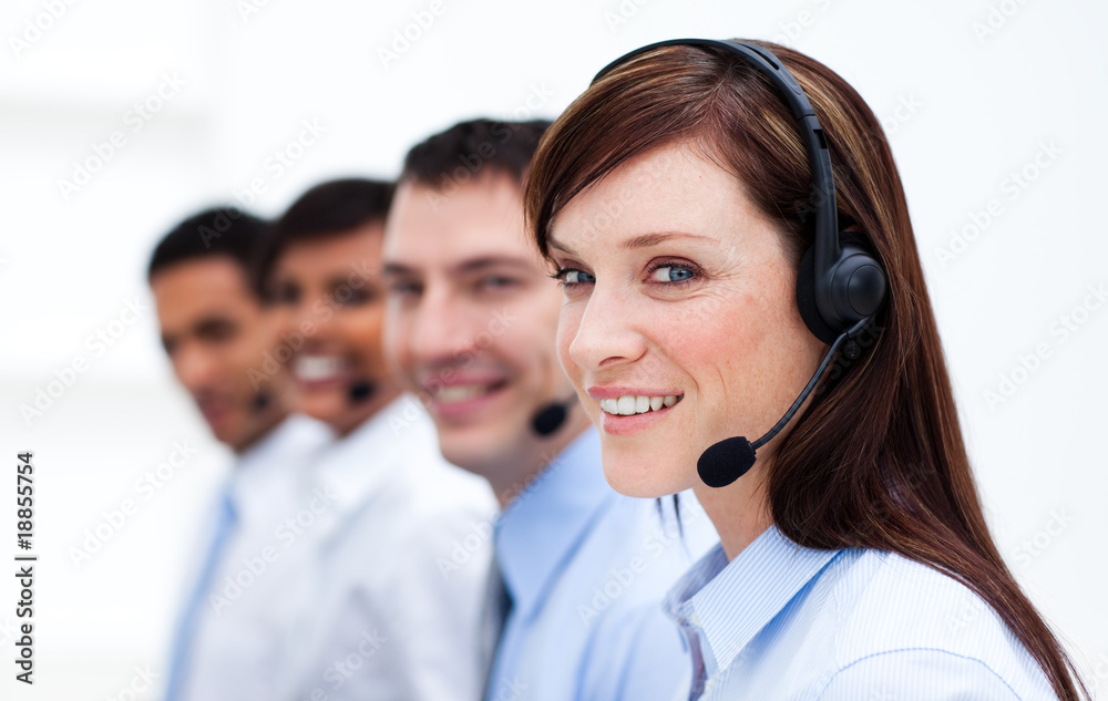 Business team with headset on working in a call center Business team with headset on working in a call center