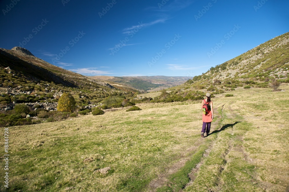 red woman hiking in gredos