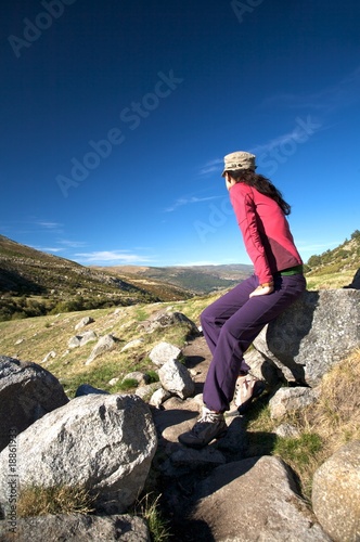 sitting on rock wall