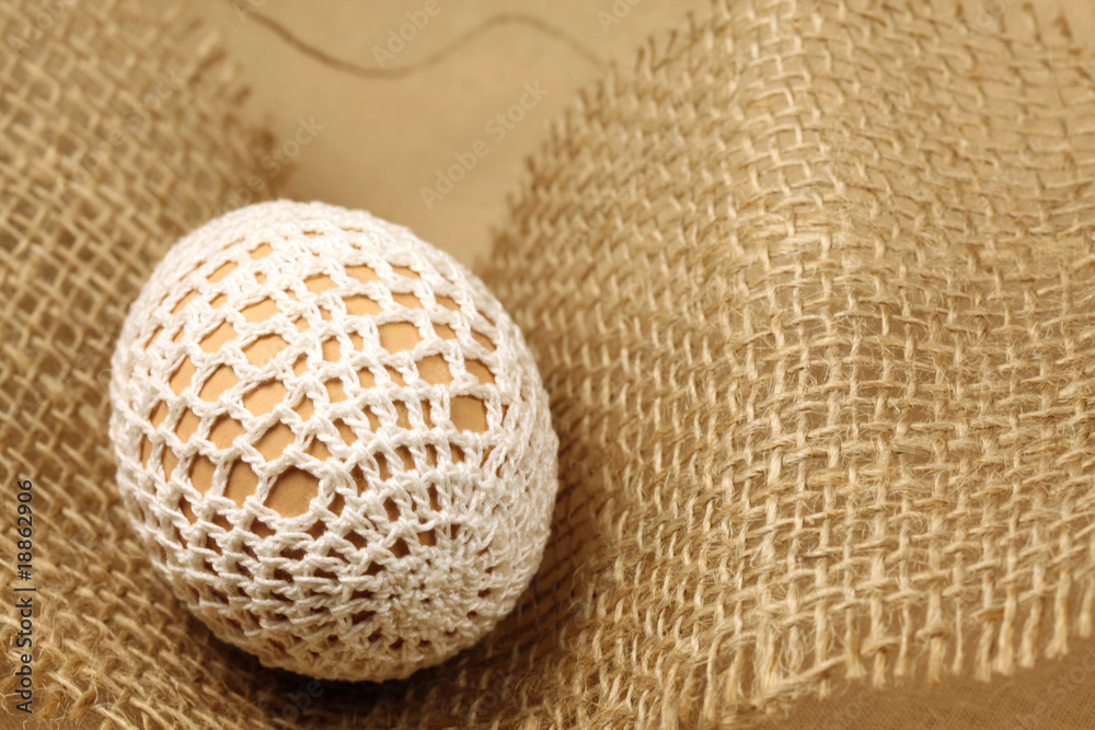 Easter egg with white crochet decoration Easter egg with white crochet decoration