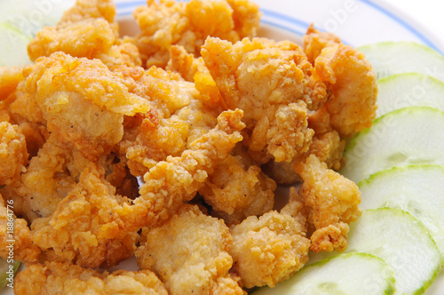 plate of chicken nugget with cucumber close up
