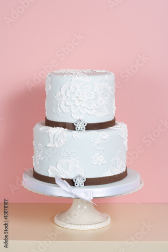 Two-tiered Cake Against Pink Background