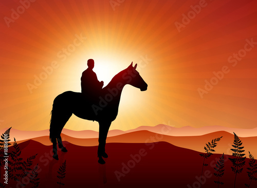 man on horse sunset background