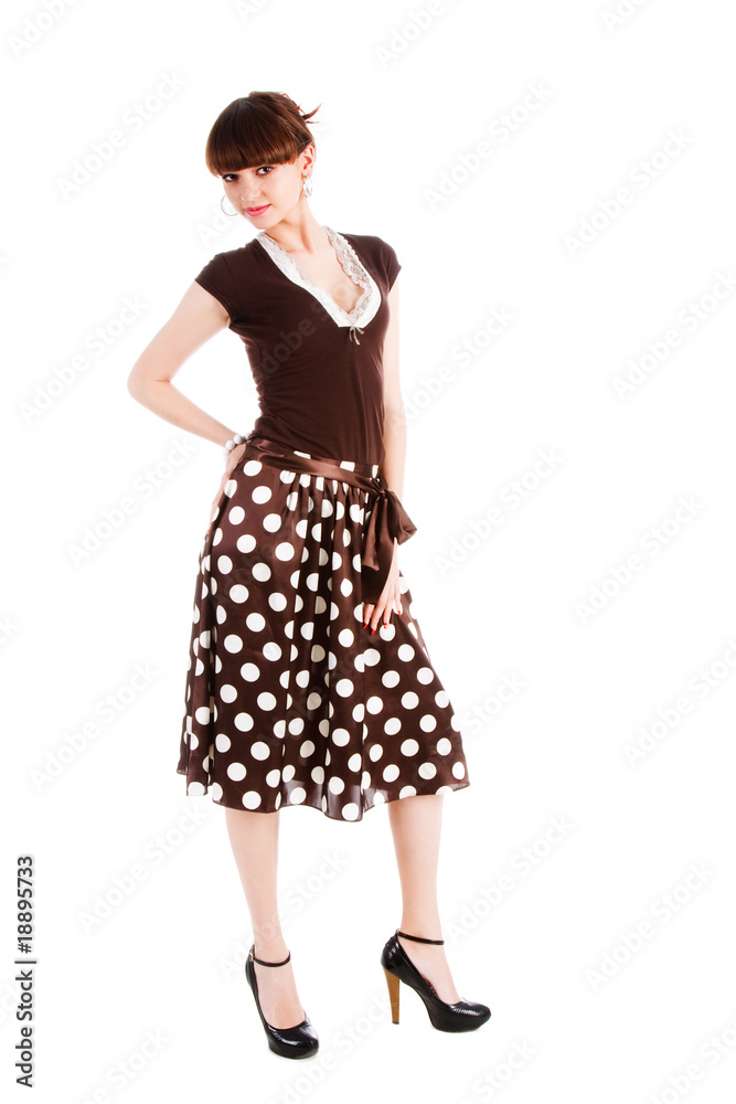 Beautiful alluring girl in spotted skirt