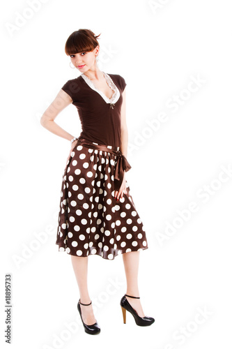 Beautiful alluring girl in spotted skirt