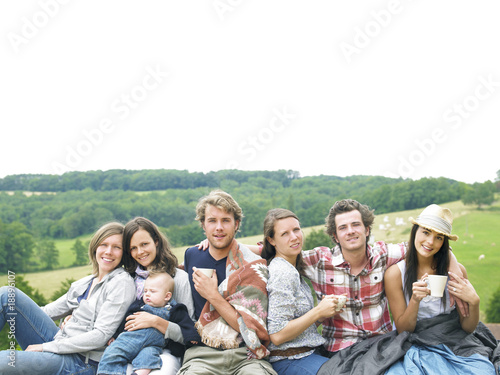 Group of People Relaxing Outdoors With Coffee