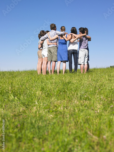 Group of People in Huddle in Field
