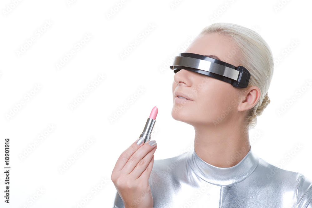 Beautiful cyber woman applying make-up ....