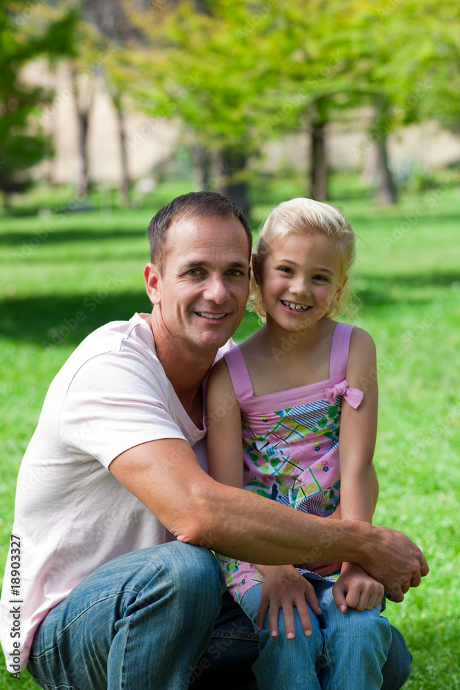 Smiling father and his daughter having a picnic Smiling father and his daughter having a picnic