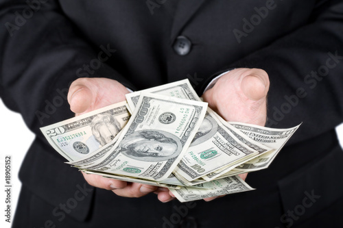Hands holding dollars isolated on white