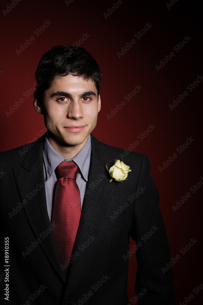 Young happy smiling handsome man with rose Young happy smiling handsome man with rose
