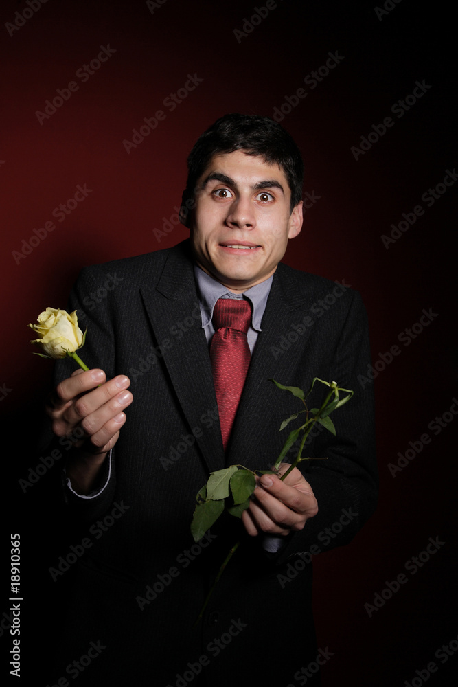 Young happy smiling handsome man with rose Young happy smiling handsome man with rose