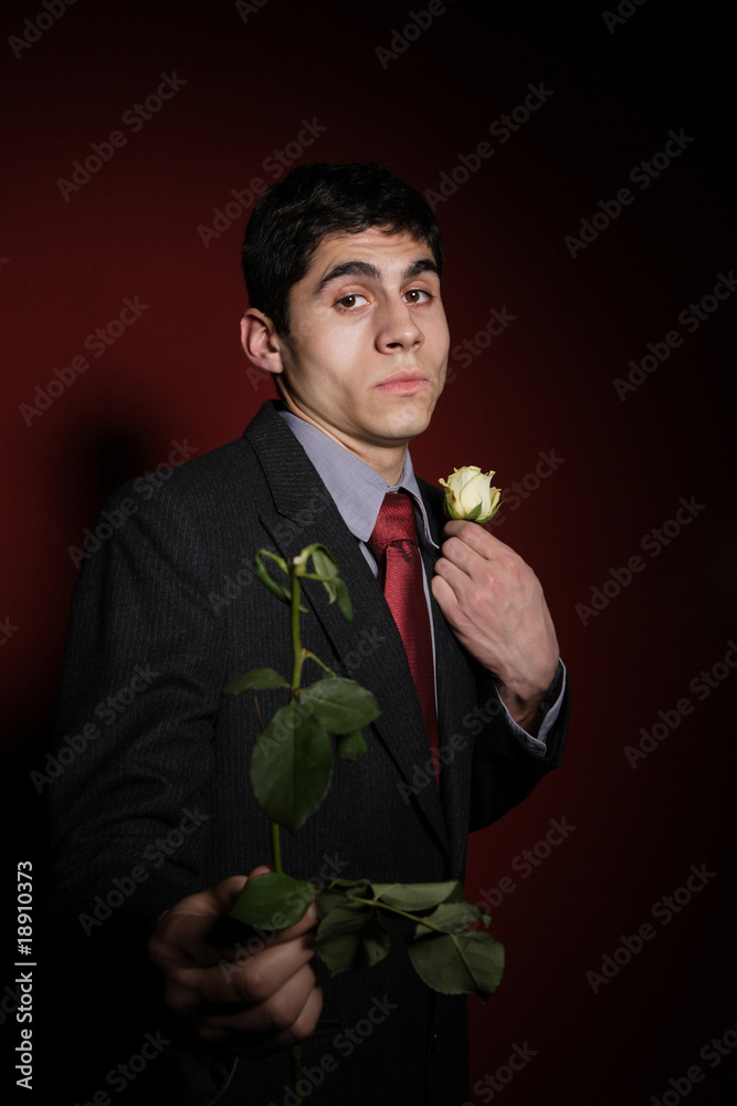 Young happy smiling handsome man with rose Young happy smiling handsome man with rose