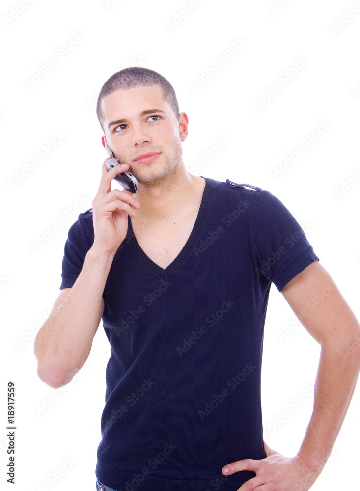 portrait of a handsome young man, talking on the phone. Isolated portrait of a handsome young man, talking on the phone. Isolated