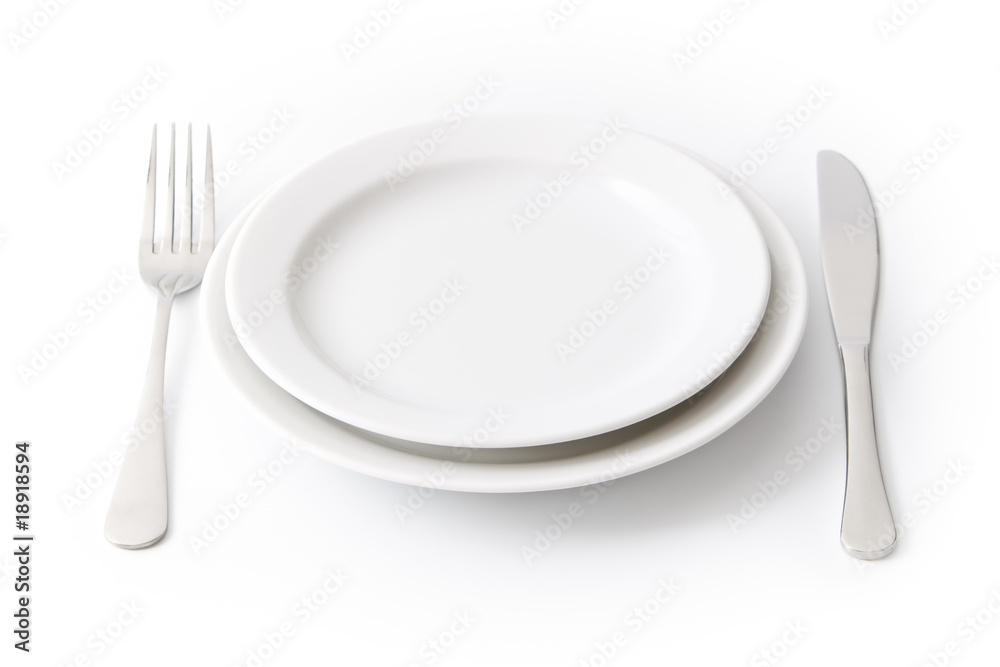 Served place setting: empty dinner plate on white background Served place setting: empty dinner plate on white background