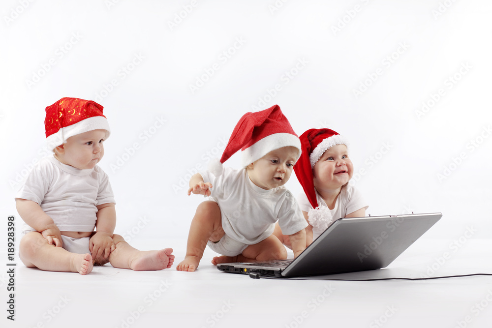 Christmas babies with laptop Christmas babies with laptop