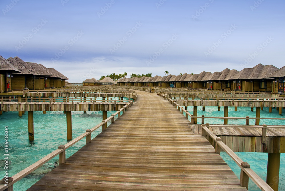 Fototapeta premium Hotel on tropical island, Maldives, water villas