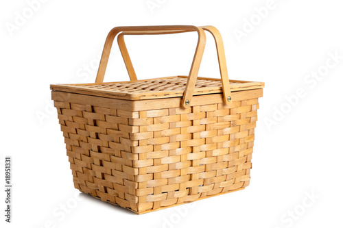 Wicker picnic basket on white