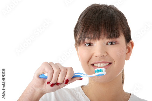 Washing her teeth
