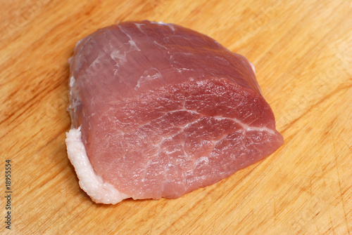 Pork meat on cutting board